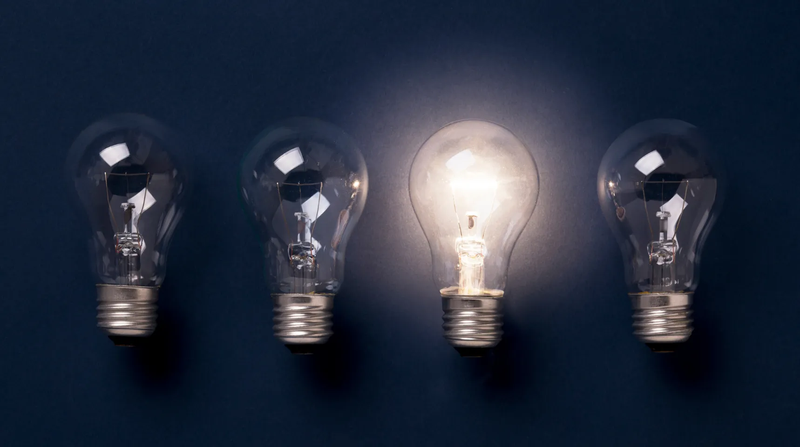 4 lied lightbulbs, one lighted