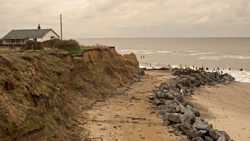 Beach with house and rocks